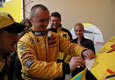 Stan Matejovsky decorating his Tatra with his trophey for winning in German Lausitzring, which brought him on the post of European Champion in category SRT B