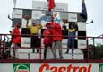 Stan Matejovsky on the winner post in Belgian Zolder ( 1. place Roland Rehfeld, 3. place Noel Crozier)